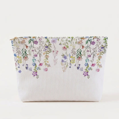 Trousse maquillage motif Flora sur fond blanc